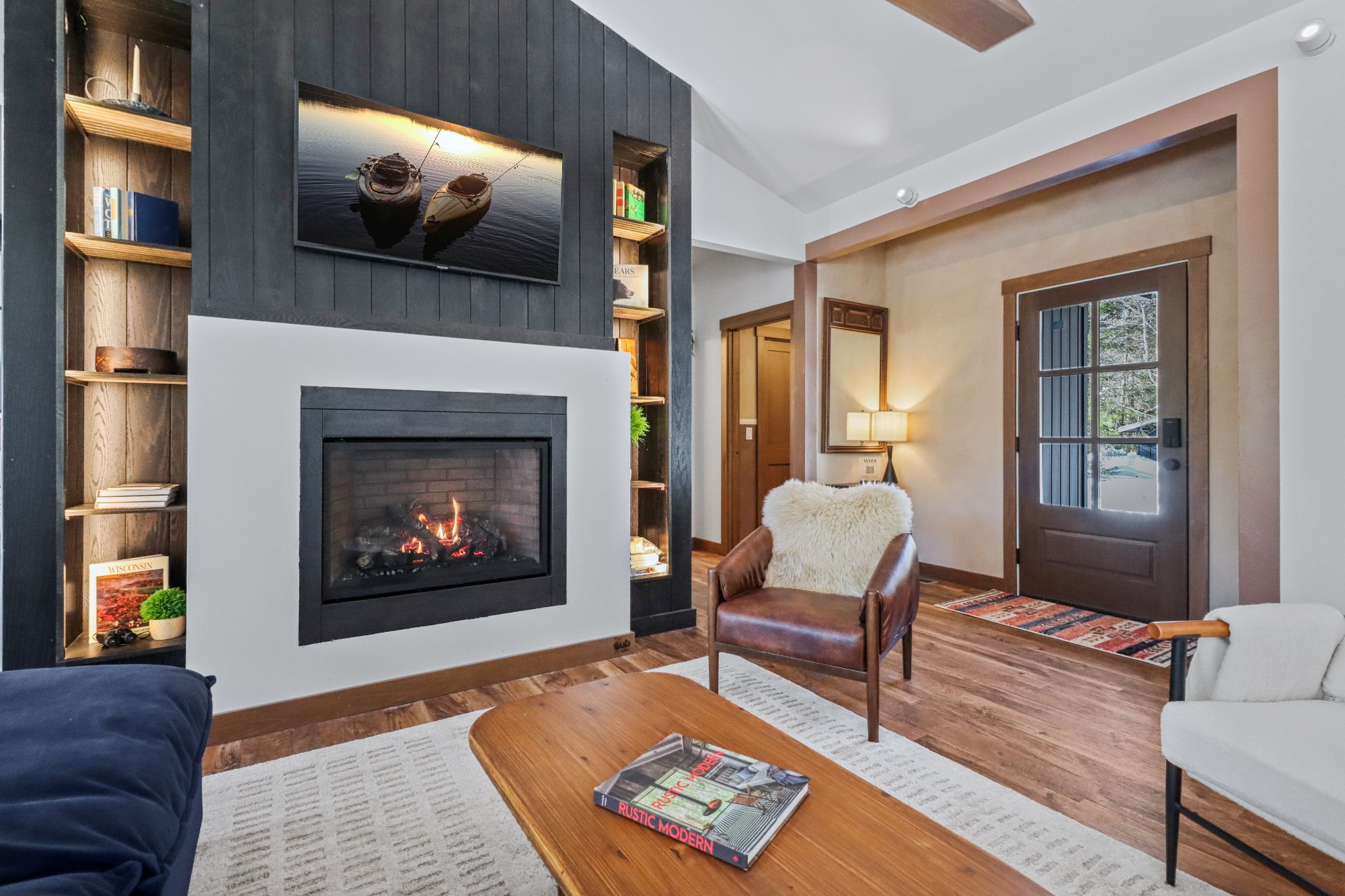 Fireplace built-in shelves leather chair entry