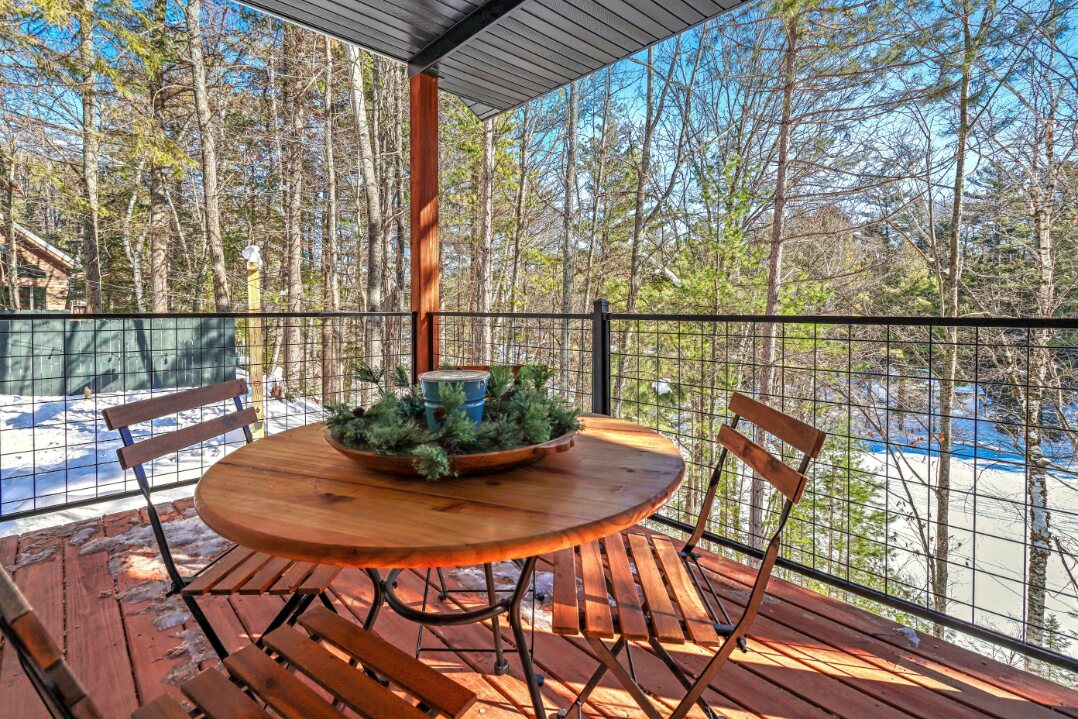 Round dining table on the covered deck