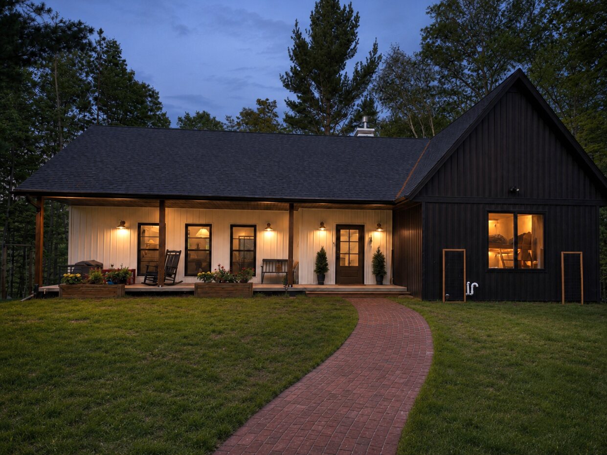 The Cub House exterior and landscaped path at evening