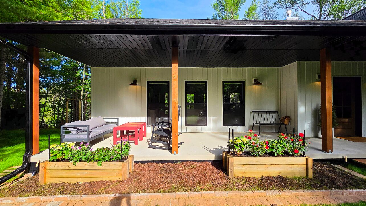 Landscaped rear patio and covered porch in summer