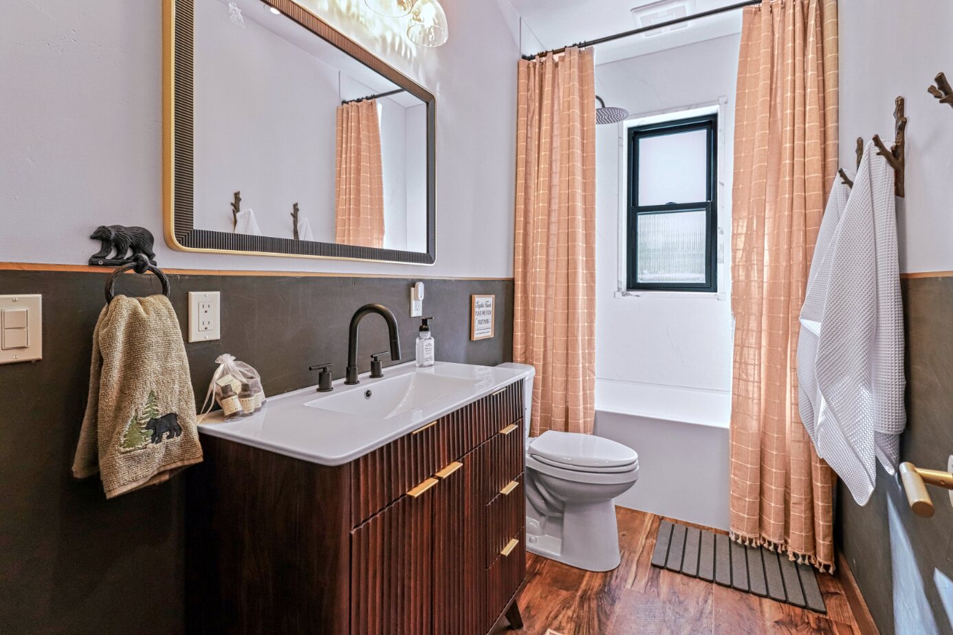 Guest bathroom walnut vanity and clawfoot tub
