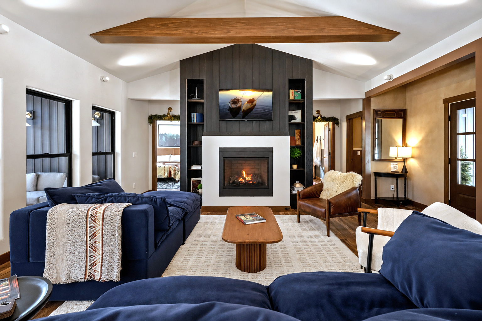 The Cub House living room, fireplace, and open kitchen