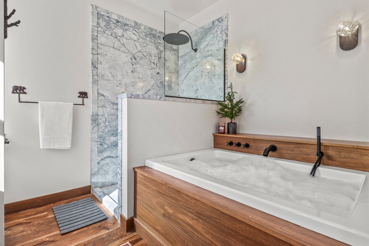 Primary bathroom soaking tub and marble shower